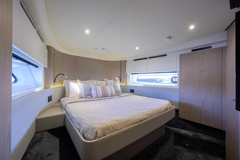 Bg 53 Yacht Photos Pics Luxurious bedroom interior of 2024 Azimut 53 Fly yacht with modern design and cozy lighting.