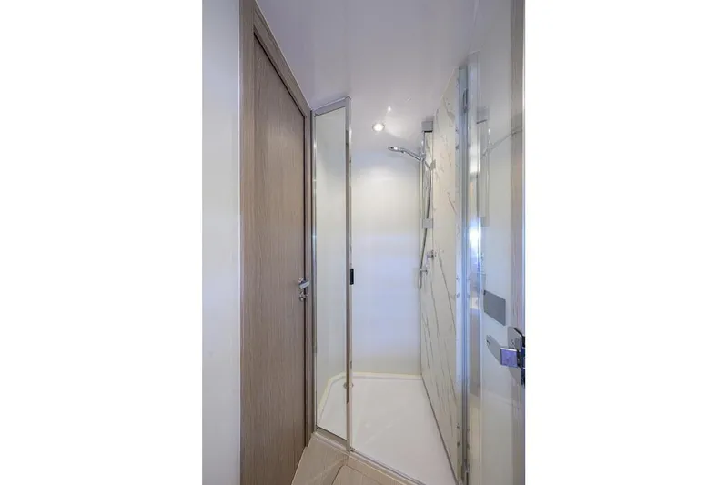 Bg 53 Yacht Photos Pics Shower area in 2024 Azimut 53 Fly yacht, featuring modern design and glass enclosure.