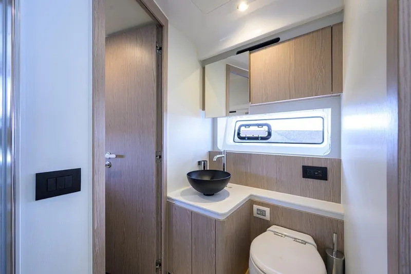 Bg 53 Yacht Photos Pics Luxurious bathroom interior of 2024 Azimut 53 Fly yacht with modern fixtures.