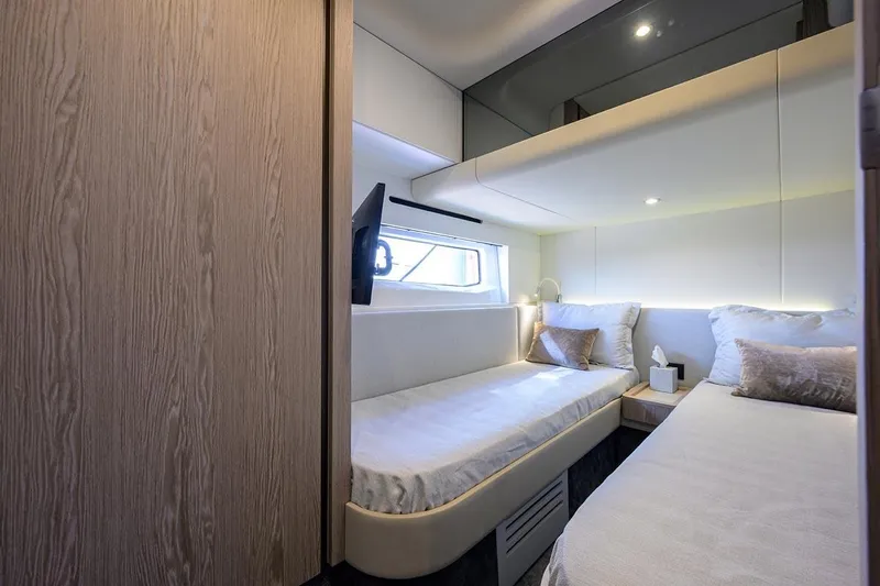 Bg 53 Yacht Photos Pics Luxurious cabin interior of 2024 Azimut 53 Fly yacht with twin beds and modern decor.
