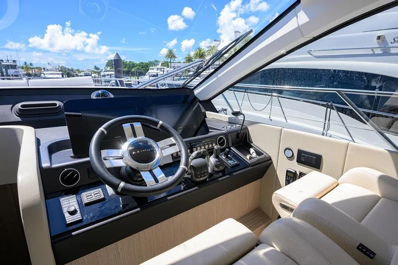 Bg 53 Yacht Photos Pics Luxurious 2024 Azimut 53 Fly yacht cockpit with modern steering and controls.