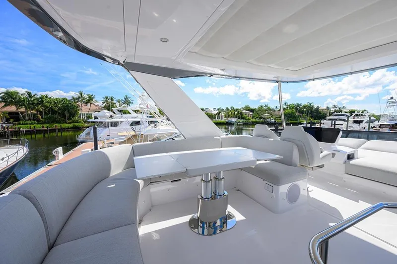 Bg 53 Yacht Photos Pics Luxurious 2024 Azimut 53 Fly yacht with spacious outdoor seating and dining area.