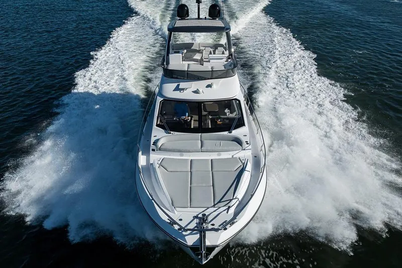 Bg 53 Yacht Photos Pics 2024 Azimut 53 Fly yacht cruising on open water, showcasing sleek design and powerful performance.
