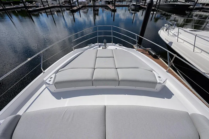 Bg 53 Yacht Photos Pics Luxurious 2024 Azimut 53 Fly yacht with spacious sunbathing area at marina.