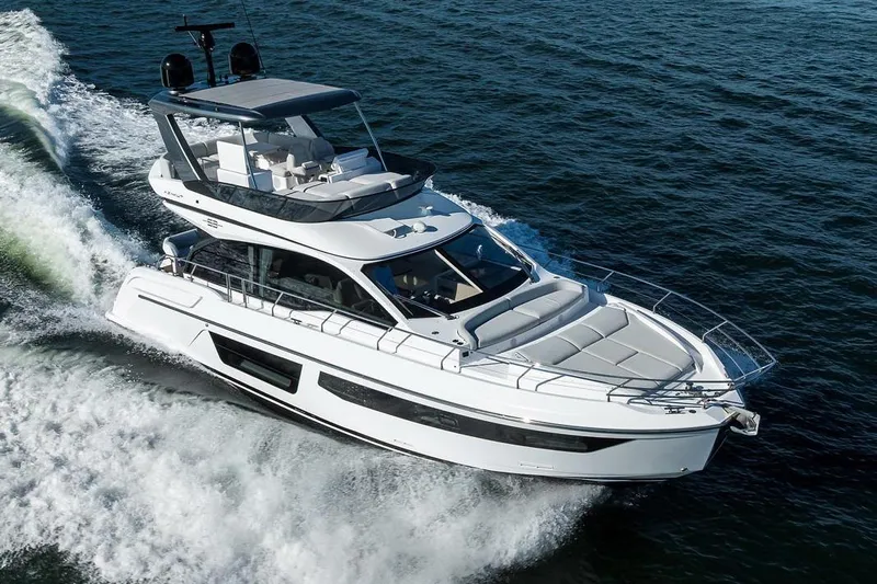 Bg 53 Yacht Photos Pics 2024 Azimut 53 Fly yacht cruising on open water, showcasing sleek design and luxury.