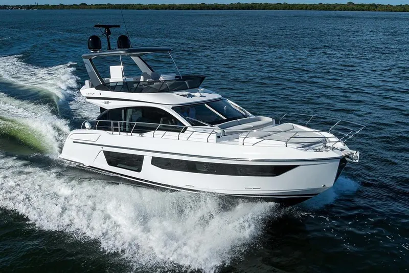 Bg 53 Yacht Photos Pics 2024 Azimut 53 Fly yacht cruising on open water, showcasing sleek design and luxury.