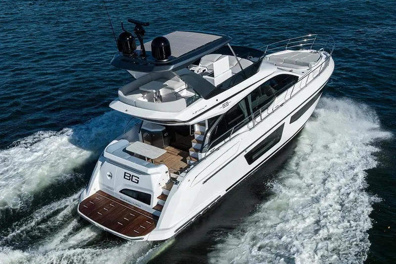 Bg 53 Yacht Photos Pics 2024 Azimut 53 Fly yacht cruising on open water, showcasing luxury design.