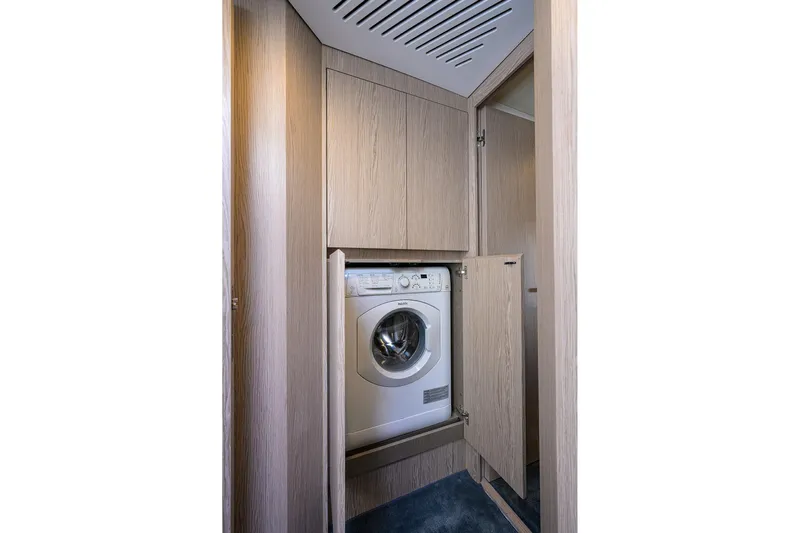Bg 53 Yacht Photos Pics Laundry area with washing machine in 2024 Azimut 53 Fly yacht.