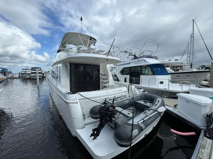 Endymion Yacht Photos Pics 2006 Carver 56 Voyager yacht docked at marina, featuring inflatable boat on stern.