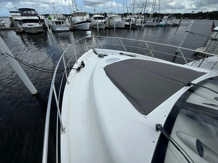 Endymion Yacht Photos Pics 2006 Carver 56 Voyager yacht docked at marina, surrounded by other boats.