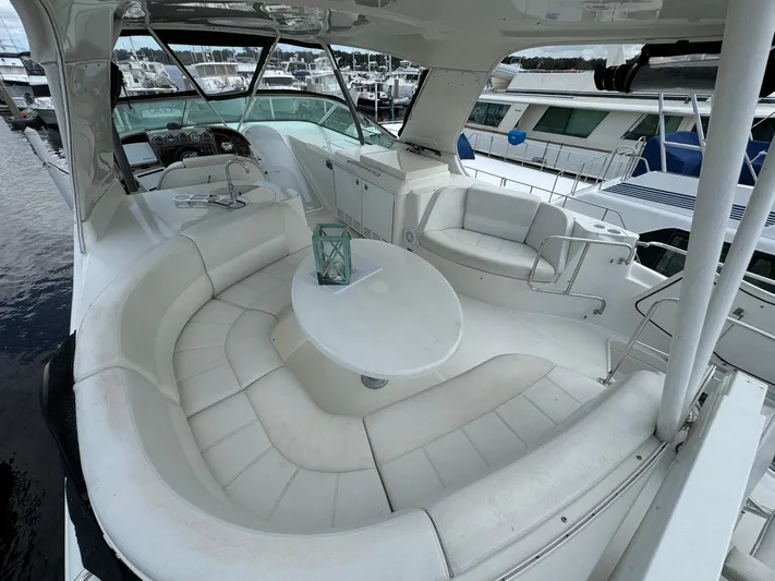 Endymion Yacht Photos Pics Luxurious 2006 Carver 56 Voyager yacht with spacious white seating area.