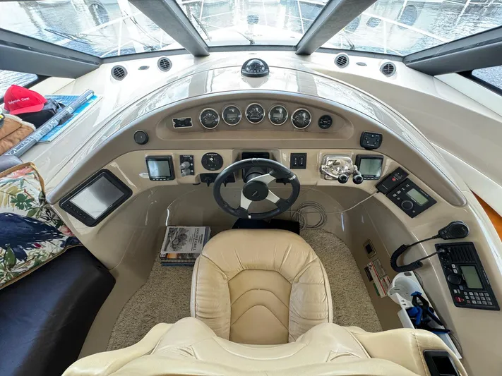 Endymion Yacht Photos Pics Helm of 2006 Carver 56 Voyager yacht with steering wheel and control panel.