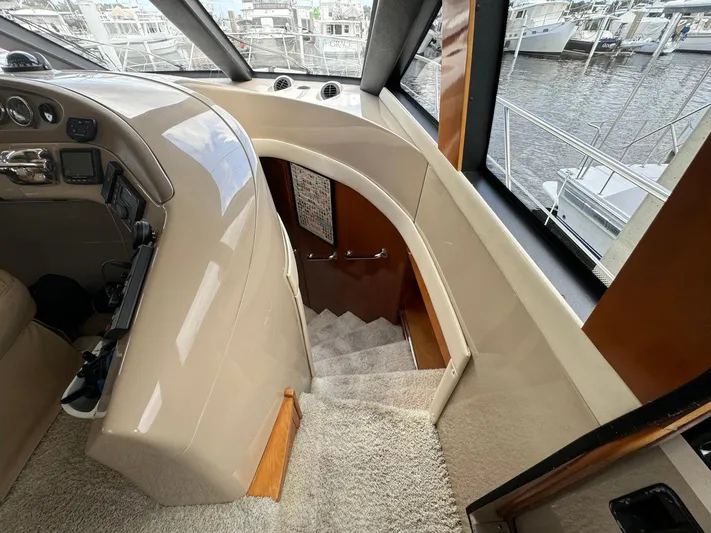 Endymion Yacht Photos Pics Interior view of 2006 Carver 56 Voyager yacht, featuring helm and staircase.