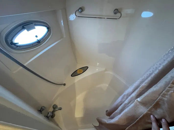 Endymion Yacht Photos Pics Bathroom interior of 2006 Carver 56 Voyager yacht with porthole and shower.