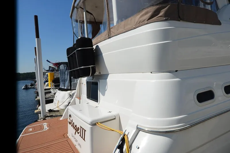 Stage III Yacht Photos Pics 2001 Cruisers Yachts 3750 Motoryacht docked, showcasing sleek design and spacious deck.