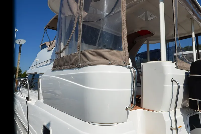 Stage III Yacht Photos Pics 2001 Cruisers Yachts 3750 Motoryacht, white exterior, docked under clear blue sky.