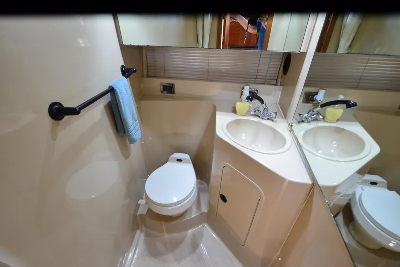 Stage III Yacht Photos Pics Bathroom interior of 2001 Cruisers Yachts 3750 Motoryacht with dual sinks and toilet.