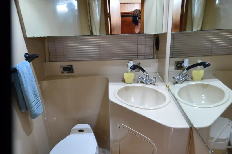 Stage III Yacht Photos Pics Bathroom interior of 2001 Cruisers Yachts 3750 Motoryacht with sink and mirror.