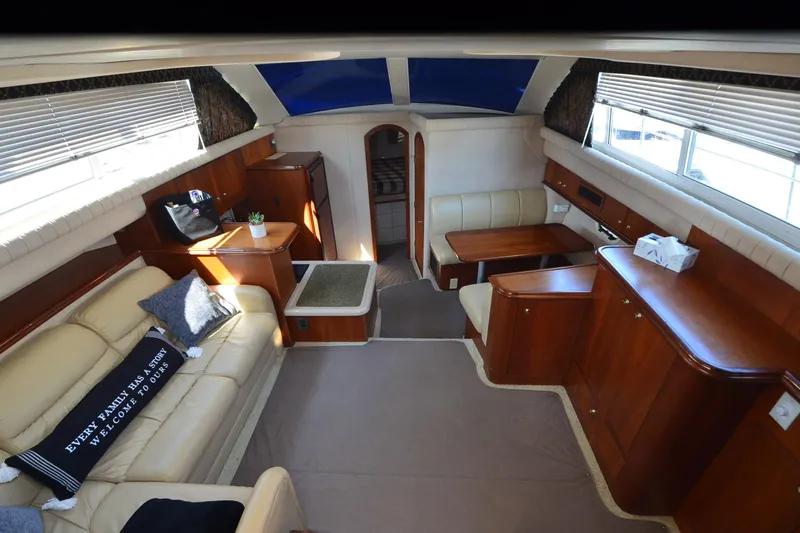 Stage III Yacht Photos Pics Luxurious interior of 2001 Cruisers Yachts 3750 Motoryacht with elegant seating and wood finishes.