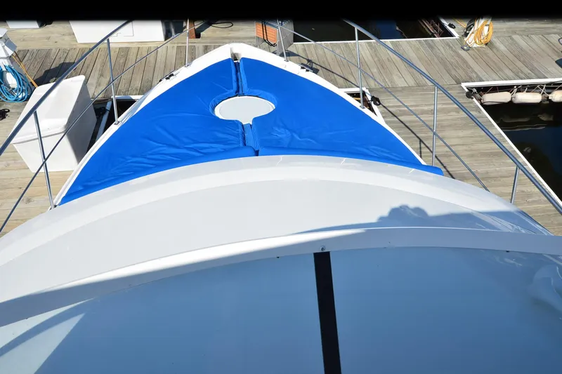 Stage III Yacht Photos Pics 2001 Cruisers Yachts 3750 Motoryacht bow with blue cover at dock.