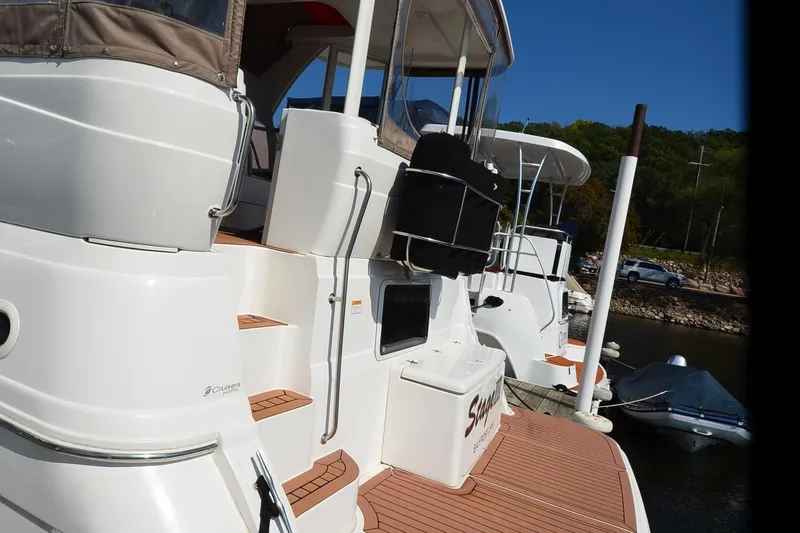 Stage III Yacht Photos Pics 2001 Cruisers Yachts 3750 Motoryacht docked, showcasing sleek design and spacious deck.