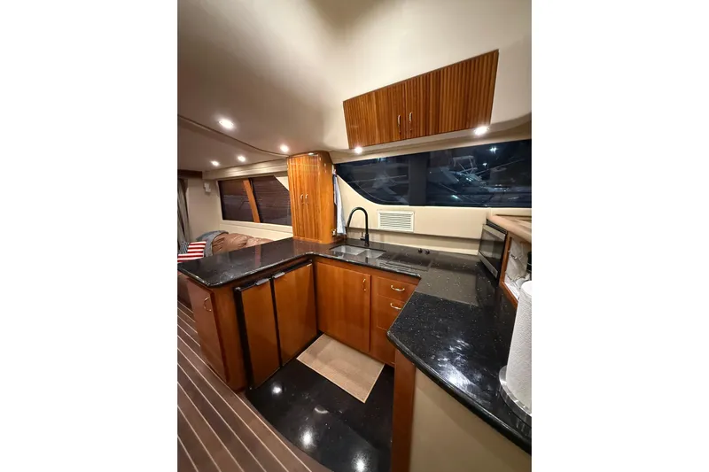 Orion Yacht Photos Pics Luxurious 2004 Carver 460 Voyager yacht interior with sleek kitchen design.