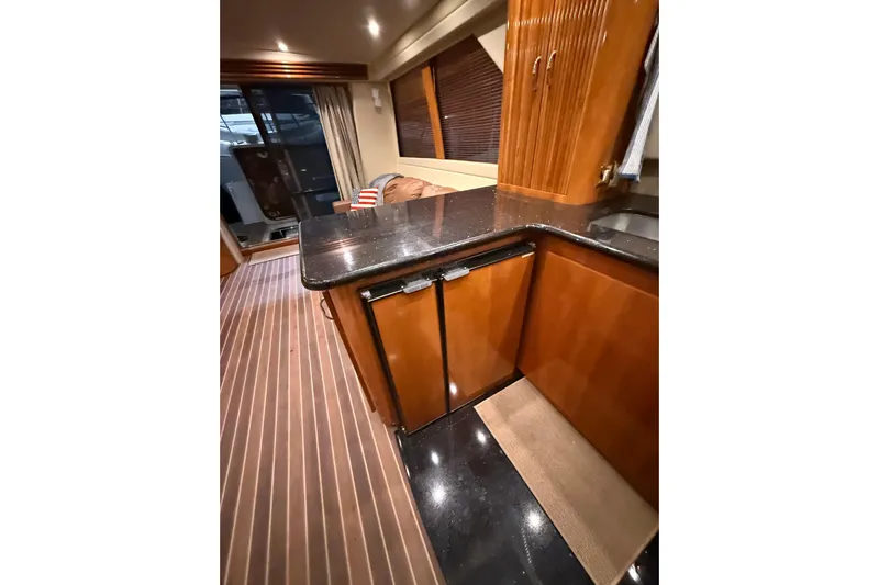 Orion Yacht Photos Pics Interior of 2004 Carver 460 Voyager yacht with sleek wood cabinetry and modern design.