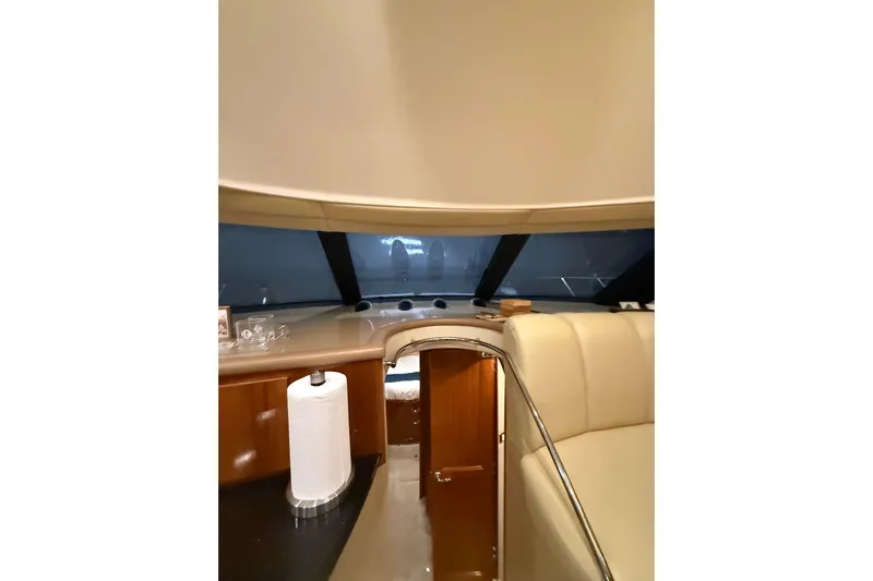 Orion Yacht Photos Pics Interior of 2004 Carver 460 Voyager yacht with leather seating and wooden cabinetry.