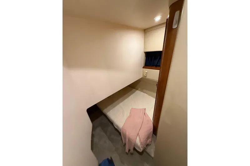 Orion Yacht Photos Pics 2004 Carver 460 Voyager cabin interior with bed and soft lighting.