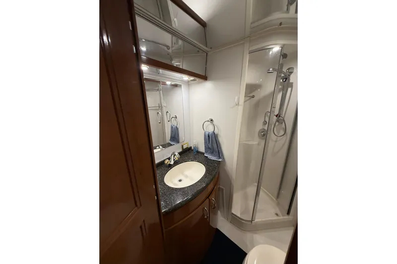 Orion Yacht Photos Pics Luxurious bathroom in 2004 Carver 460 Voyager yacht with shower and vanity.