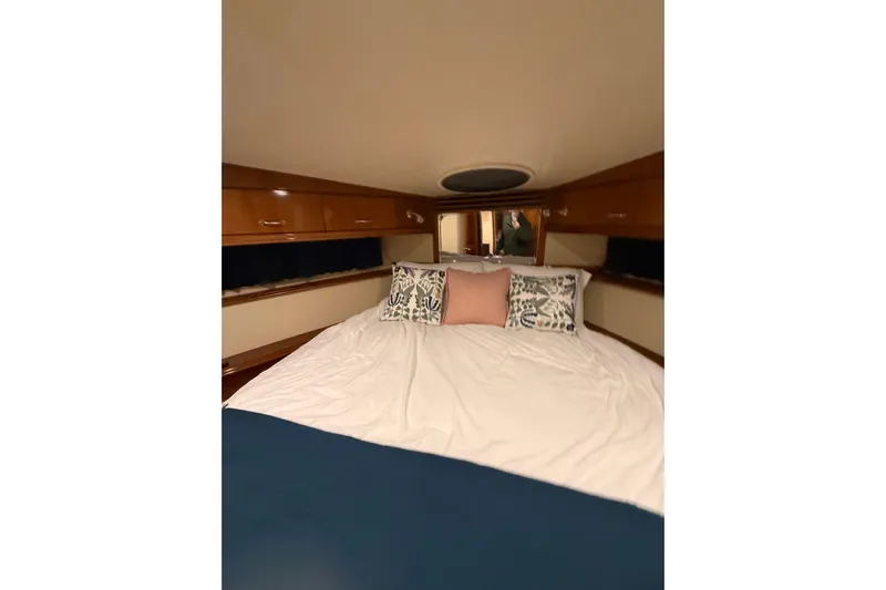 Orion Yacht Photos Pics Luxurious cabin interior of 2004 Carver 460 Voyager yacht with cozy bedding.