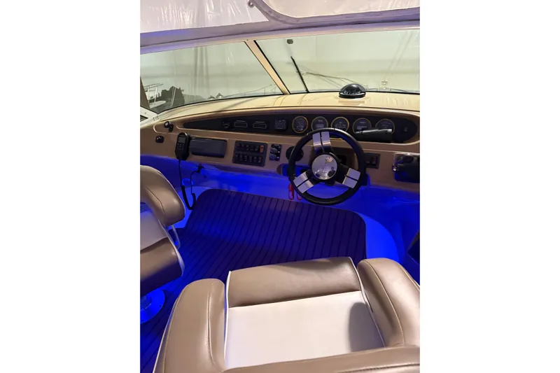 Orion Yacht Photos Pics Interior of 2004 Carver 460 Voyager yacht with illuminated dashboard and steering wheel.