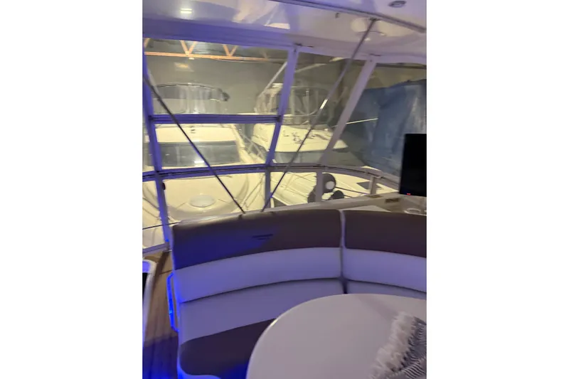 Orion Yacht Photos Pics Interior view of 2004 Carver 460 Voyager yacht with modern seating and ambient lighting.