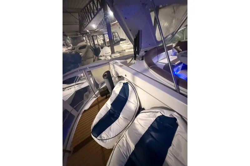 Orion Yacht Photos Pics 2004 Carver 460 Voyager yacht interior with cushioned seating and ambient lighting.