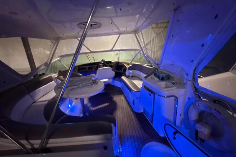 Orion Yacht Photos Pics Luxurious interior of a 2004 Carver 460 Voyager yacht with ambient blue lighting.