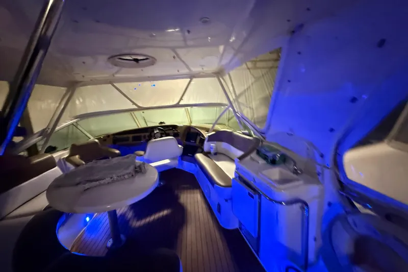 Orion Yacht Photos Pics Interior of 2004 Carver 460 Voyager yacht with blue ambient lighting.