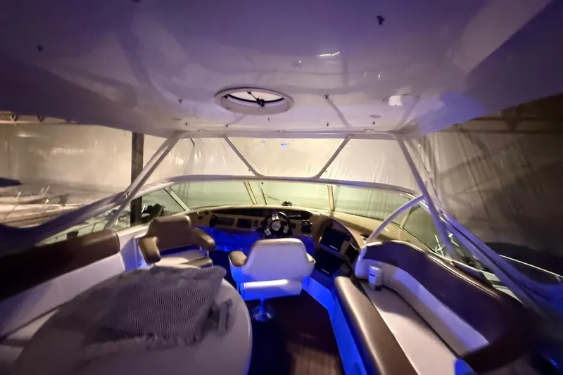 Orion Yacht Photos Pics Interior of a 2004 Carver 460 Voyager yacht with seating and helm.