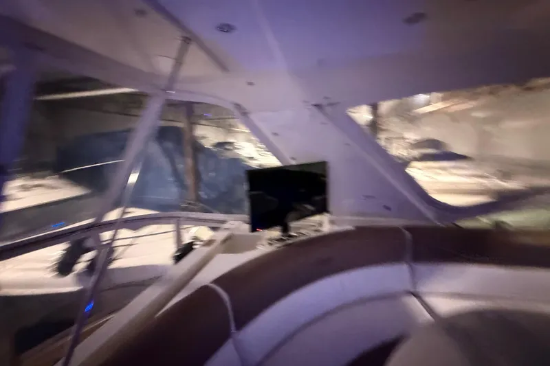 Orion Yacht Photos Pics Interior view of 2004 Carver 460 Voyager yacht with modern helm and seating area.