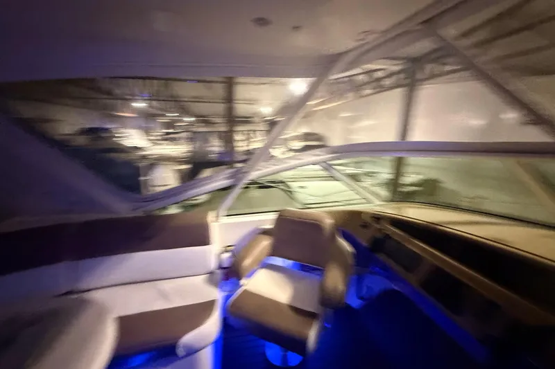 Orion Yacht Photos Pics Interior of 2004 Carver 460 Voyager yacht with seating and blue ambient lighting.