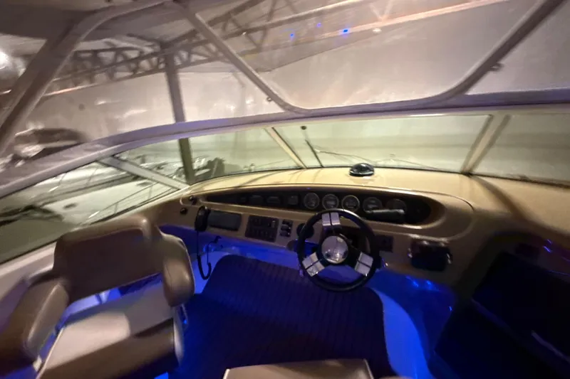 Orion Yacht Photos Pics Interior view of 2004 Carver 460 Voyager yacht cockpit with illuminated controls.