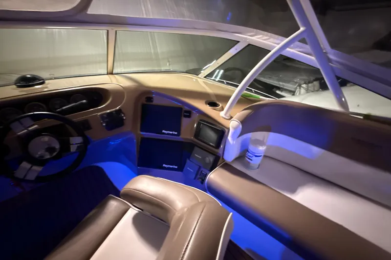 Orion Yacht Photos Pics Interior of 2004 Carver 460 Voyager yacht with illuminated dashboard and seating area.