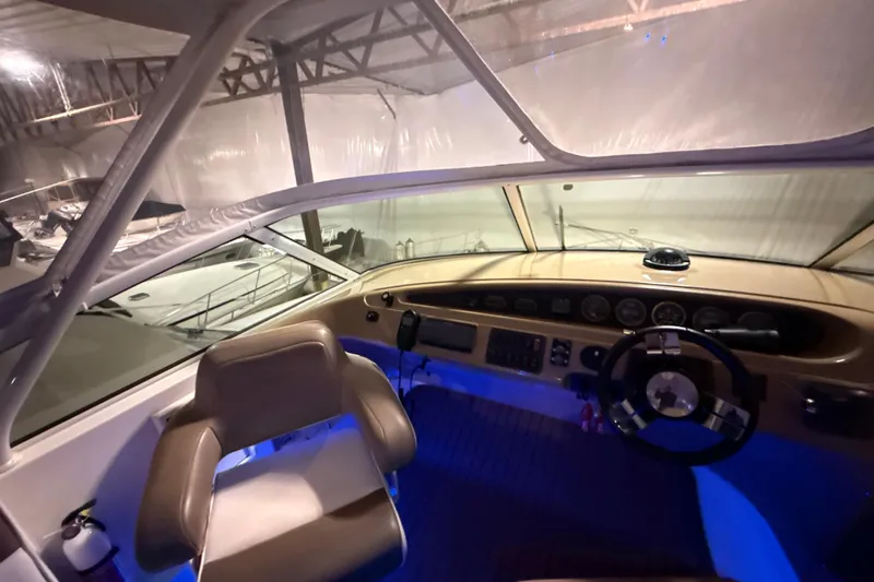 Orion Yacht Photos Pics Interior view of 2004 Carver 460 Voyager yacht cockpit with steering wheel and controls.