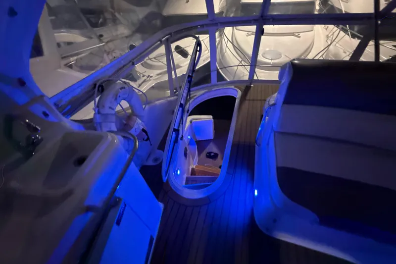 Orion Yacht Photos Pics Interior of 2004 Carver 460 Voyager yacht with blue ambient lighting.