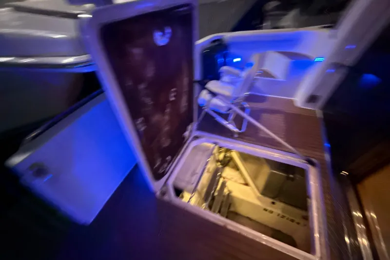 Orion Yacht Photos Pics 2004 Carver 460 Voyager yacht interior with open hatch and blue ambient lighting.