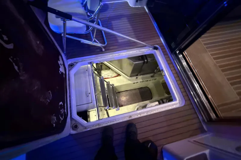 Orion Yacht Photos Pics Engine room access hatch on 2004 Carver 460 Voyager yacht, featuring interior view.