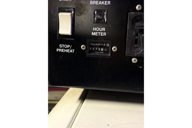 Orion Yacht Photos Pics Control panel of a 2004 Carver 460 Voyager with hour meter and switches.