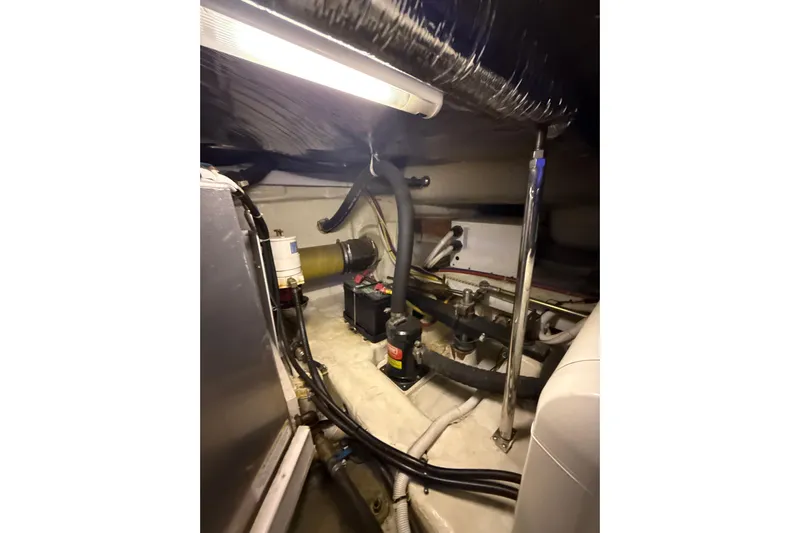 Orion Yacht Photos Pics Engine room of a 2004 Carver 460 Voyager yacht, showcasing mechanical components and wiring.