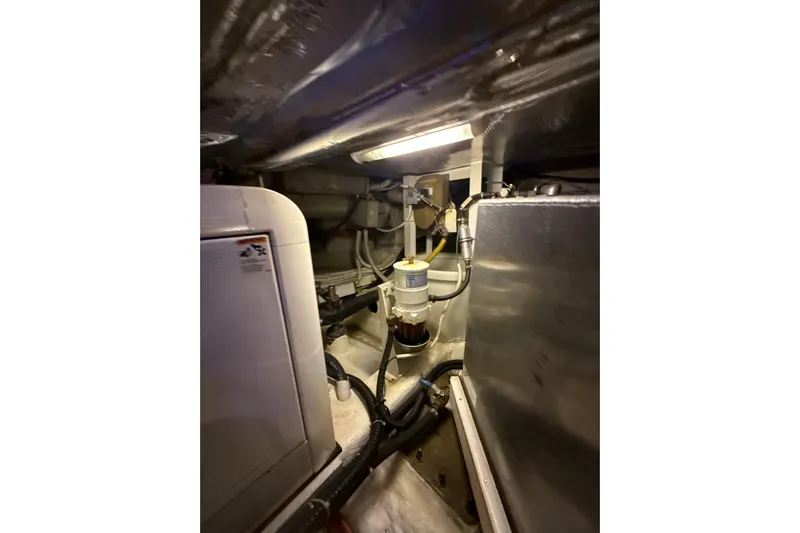 Orion Yacht Photos Pics Engine room of 2004 Carver 460 Voyager yacht, showcasing machinery and components.