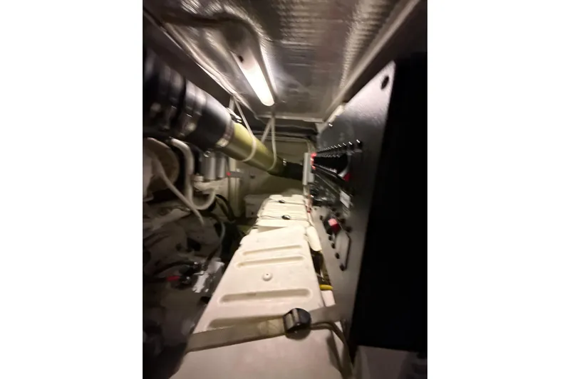 Orion Yacht Photos Pics Engine room of 2004 Carver 460 Voyager yacht, featuring control panel and mechanical components.