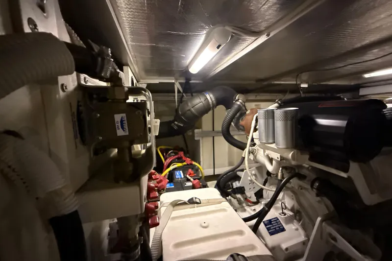 Orion Yacht Photos Pics Engine room of 2004 Carver 460 Voyager yacht, showcasing mechanical components and piping.
